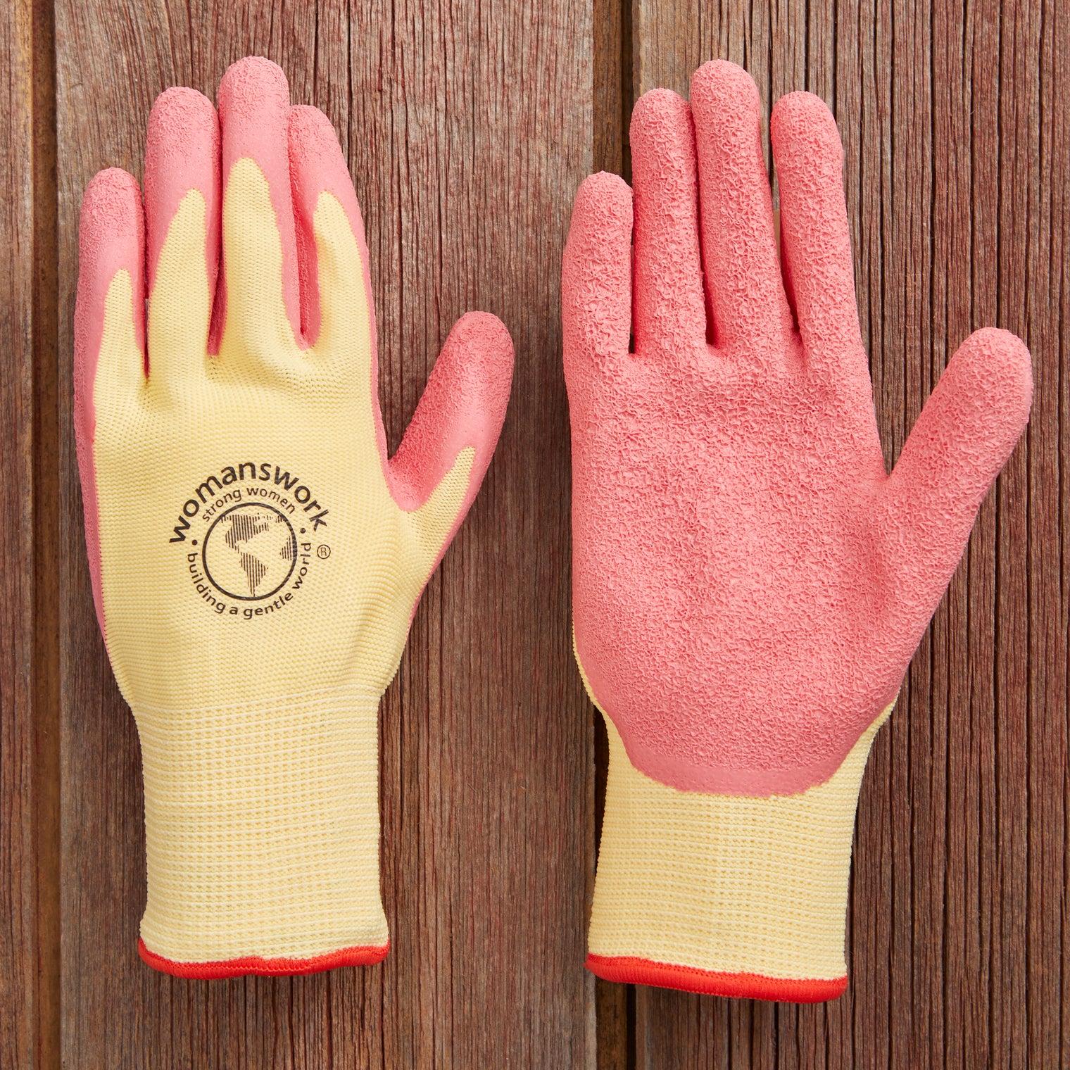 A pair of pink latex gloves